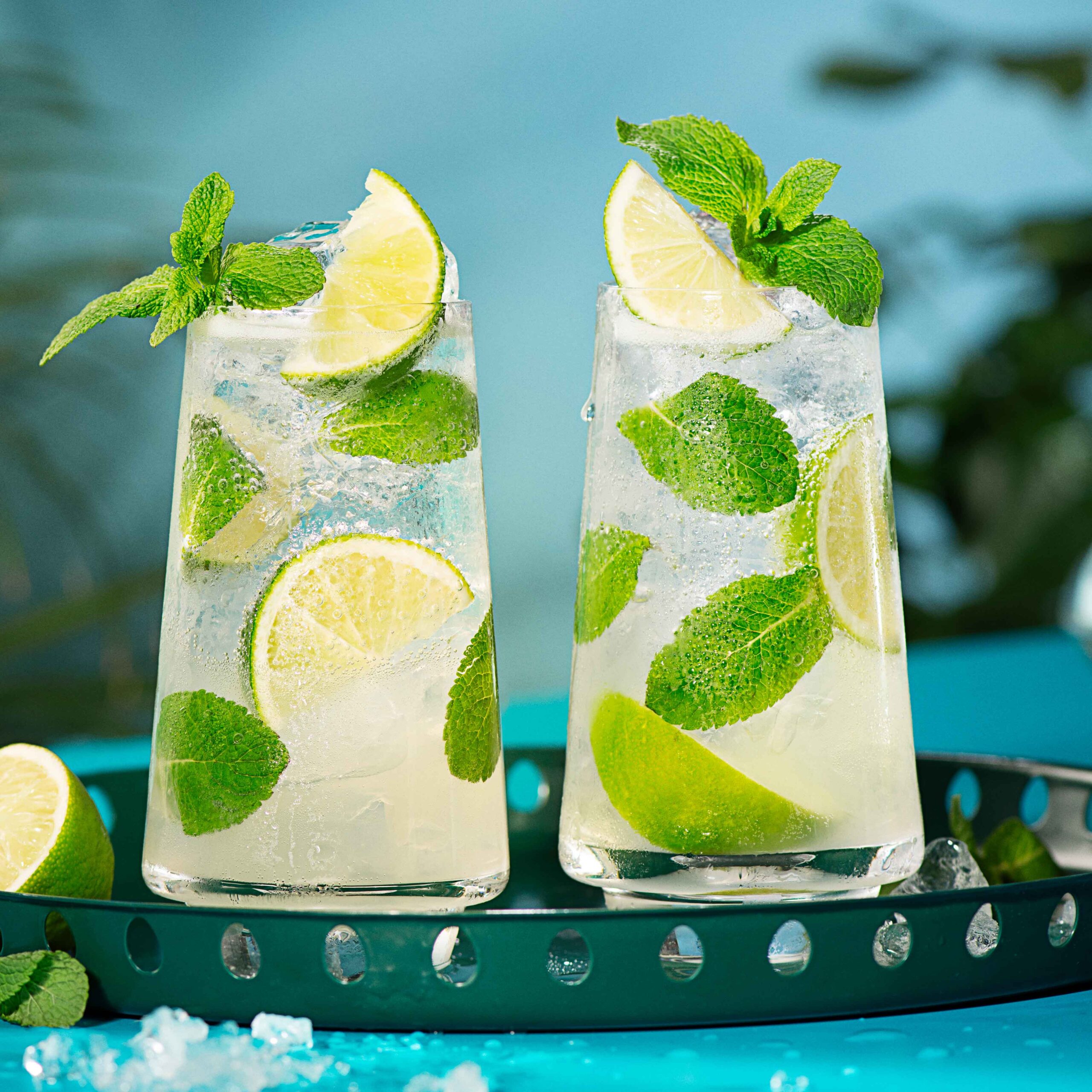2 Malibu Mojito cocktails on a serving tray, against a blue background